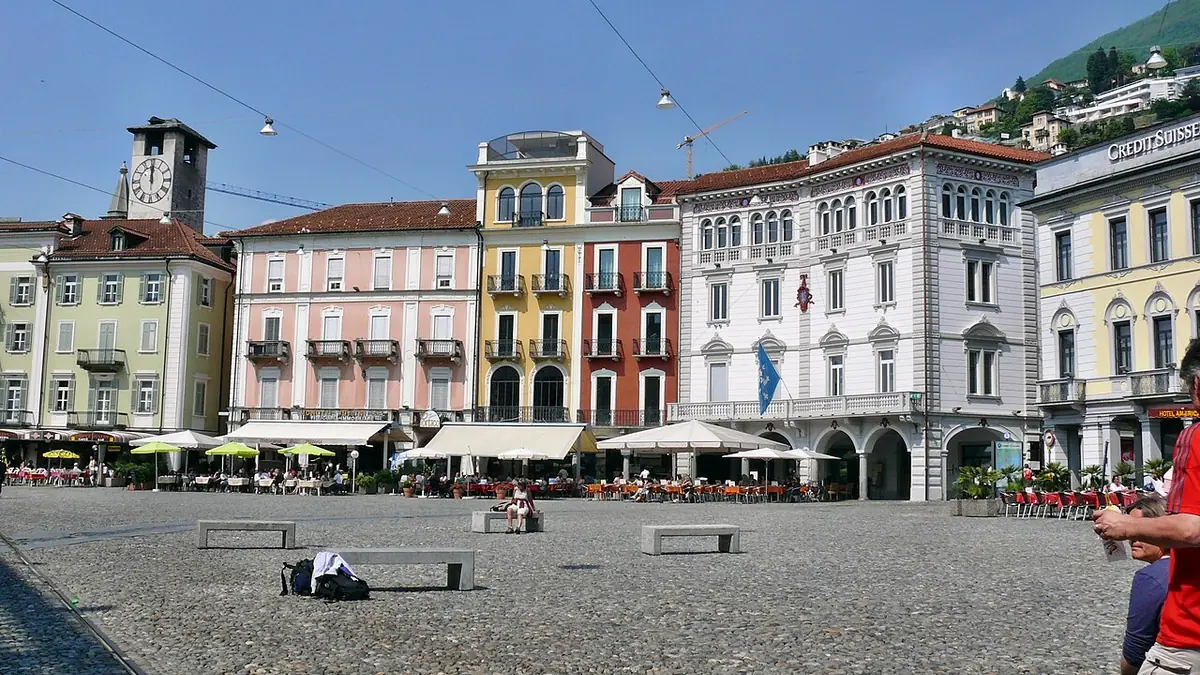A group of people protest against companies that finance the genocide in Palestine in Locarno